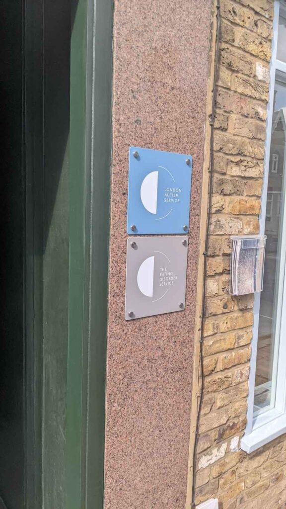 POWDER COATED ALUMINUM PLAQUES WITH WHITE VINYL LOGO in London
