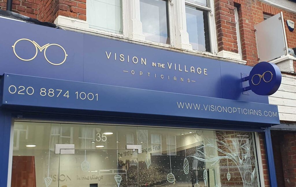 POWDER COATED ALUMINIUM CIRCULAR PROJECTING SIGN WITH GOLD WET COATED ACRYLIC LETTERS in London