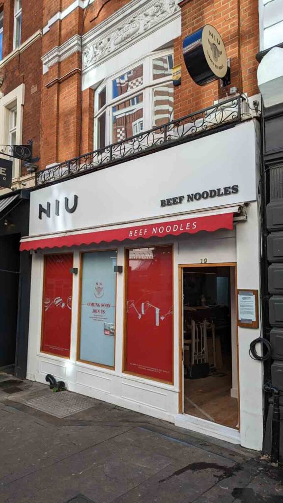 WHITE ALUMINIUM COMPOSITE SIGN TRAY WITH 10MM MATT BLACK ACRYLIC LETTERS APPLIED DIRECTLY TO FACE in London
