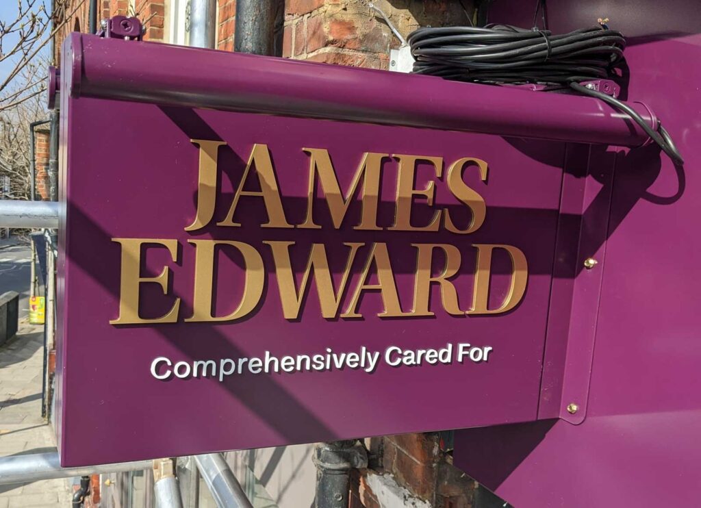 POWDER COATED PROJECTING SIGN WITH DOUBLE SIDED TROUGH LIGHTS in London