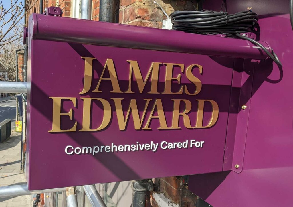 POWDER COATED PROJECTING SIGN WITH DOUBLE SIDED TROUGH LIGHTS in London